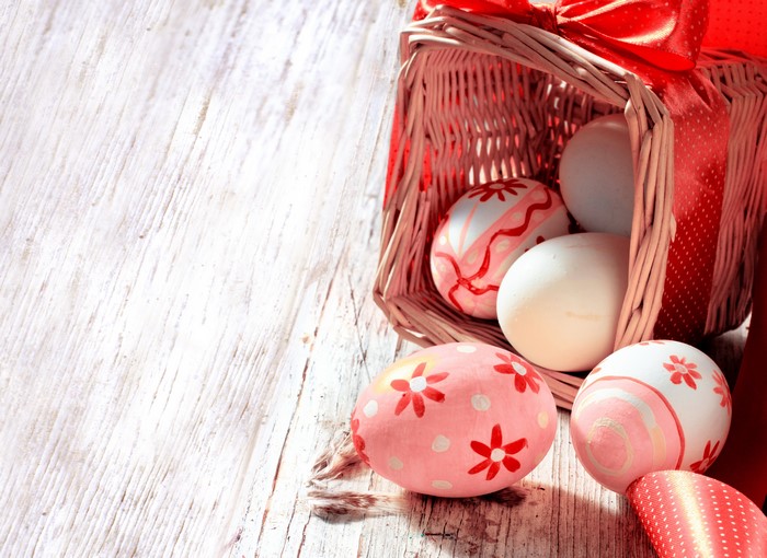 Easter Eggs in Wicker Basket with Red Ribbon