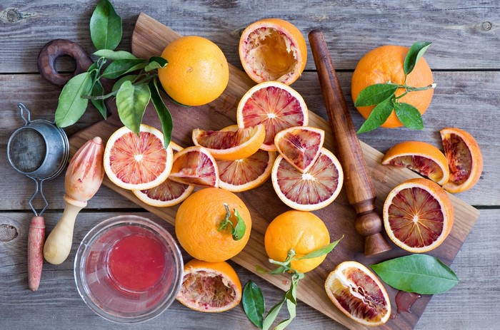 Blood oranges being prepared for juicing