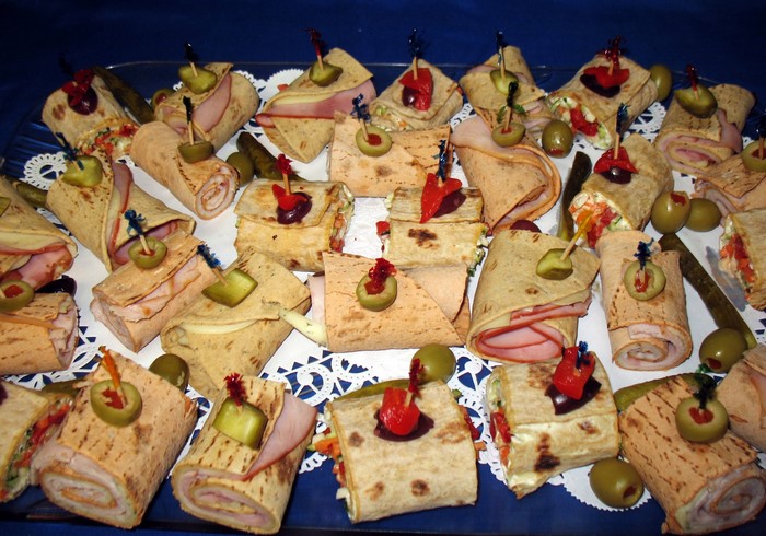 Assortment of wraps with olives and pickles