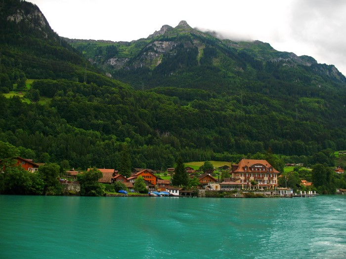 Iseltwald, Switzerland: Houses on a lake with mountains