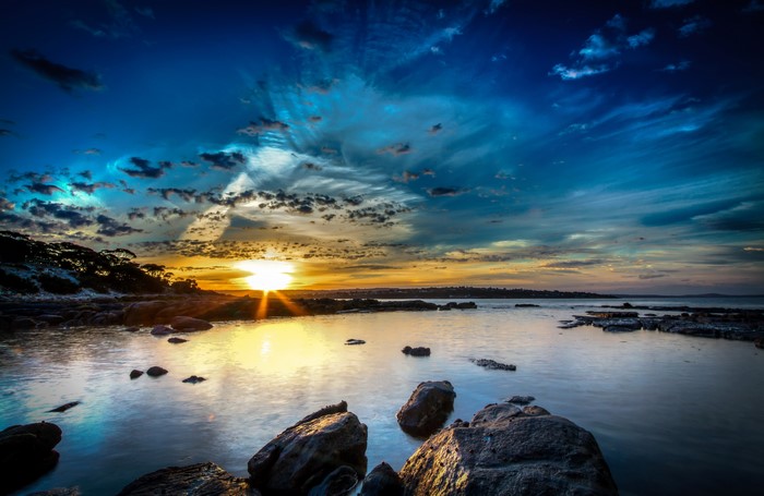 Sunset over rocky coastline in Australia