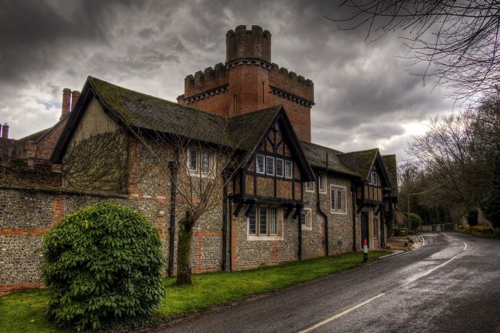 Castle-like house on a wet road in Crawley, Hampshire, England
