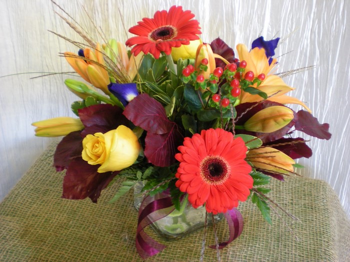 Autumnal flower arrangement with gerberas and roses