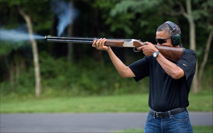 Barack Obama shooting a shotgun