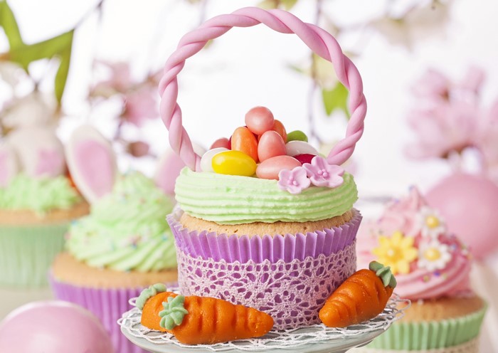 Easter cupcakes with carrots and candy eggs