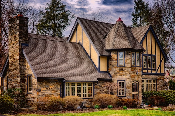 American Tudor style stone house with turret