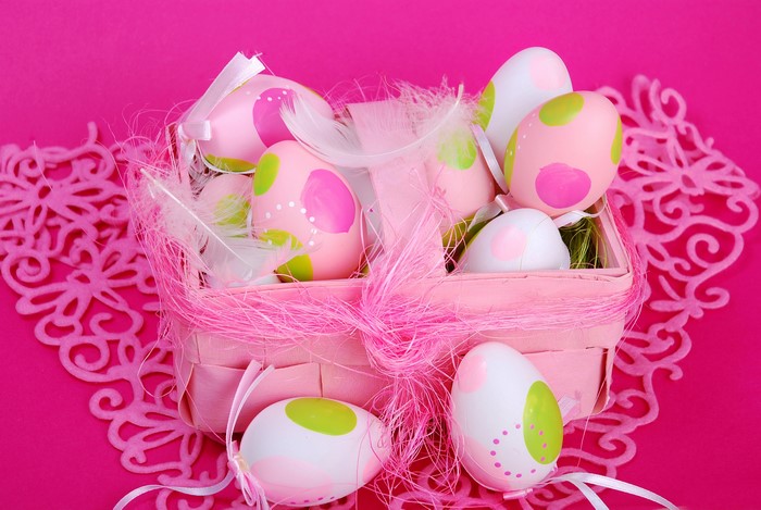 Easter Eggs in a Pink Basket with Feathers