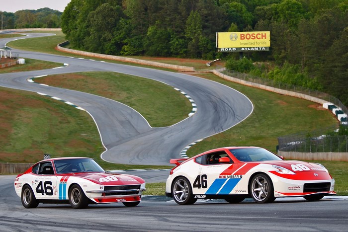 Two Nissan race cars on a track