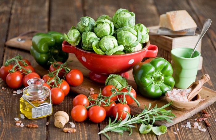 Vegetables and ingredients on a wooden table