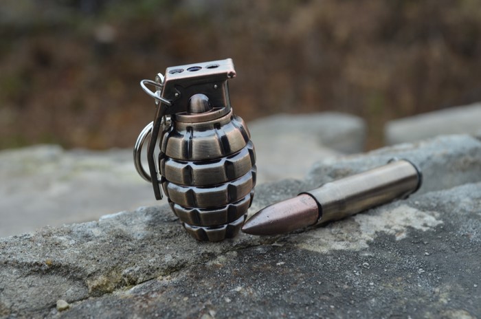 4K Closeup of Grenade and Firearm Cartridge