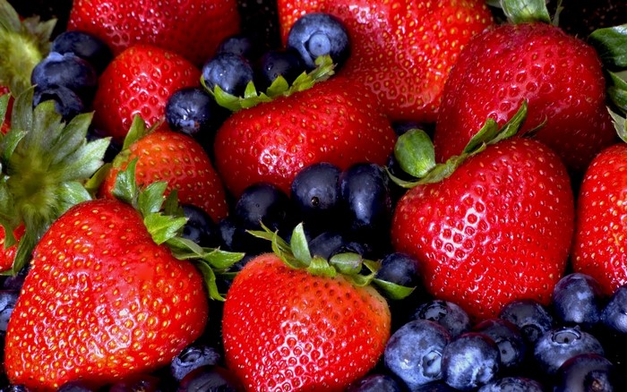 Close-up of fresh strawberries and blueberries