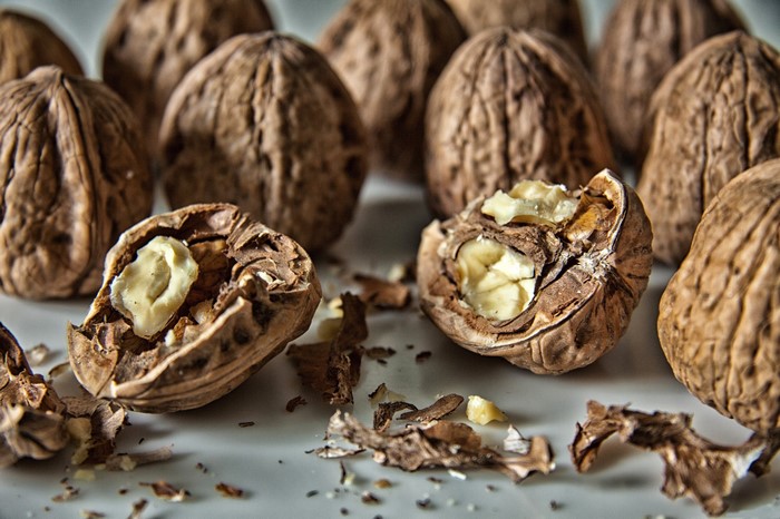 Walnuts on a white surface
