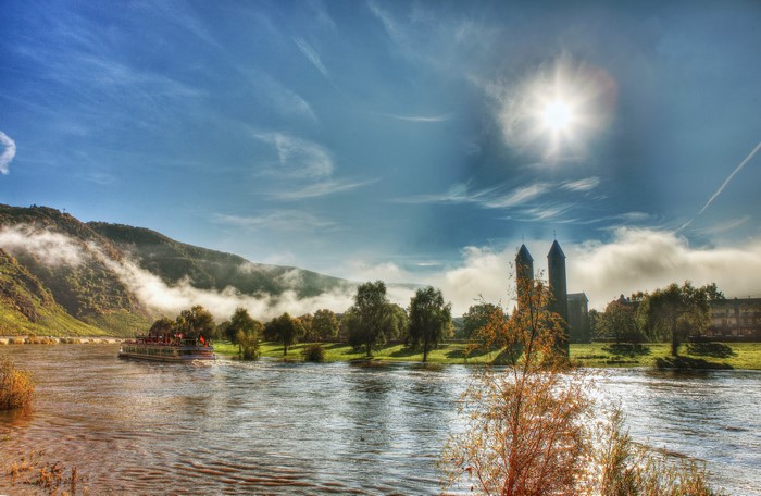 River cruise boat near Valwig, Germany with church towers