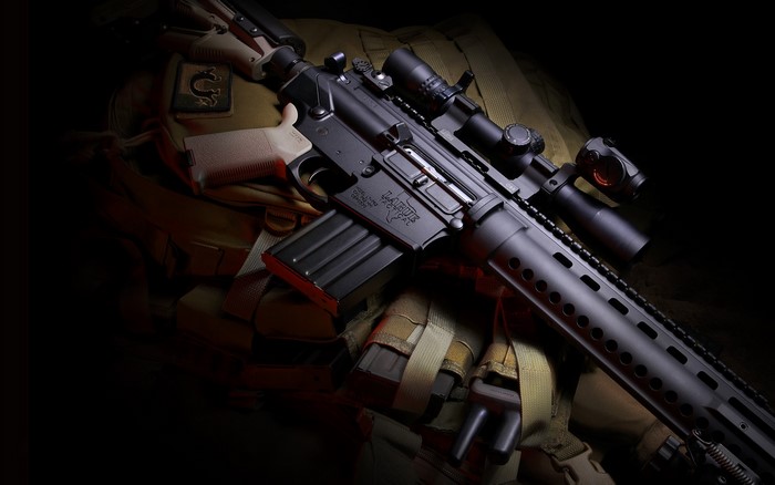 AR-15 rifle with scope and magazine