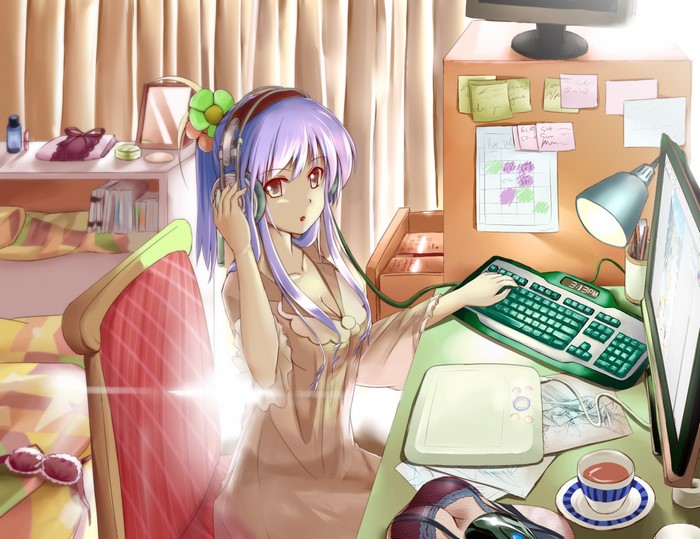 Girl with headphones at a desk
