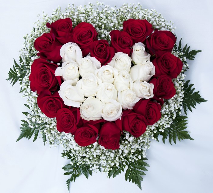 Heart shaped bouquet of red and white roses