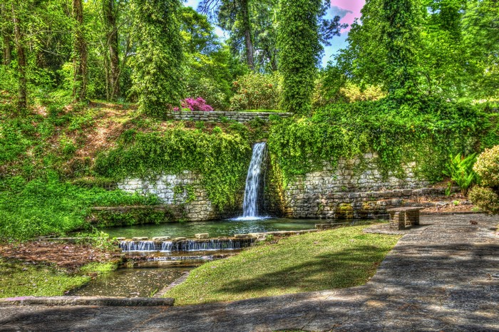 Waterfall in a lush green park in Sandel, Louisiana