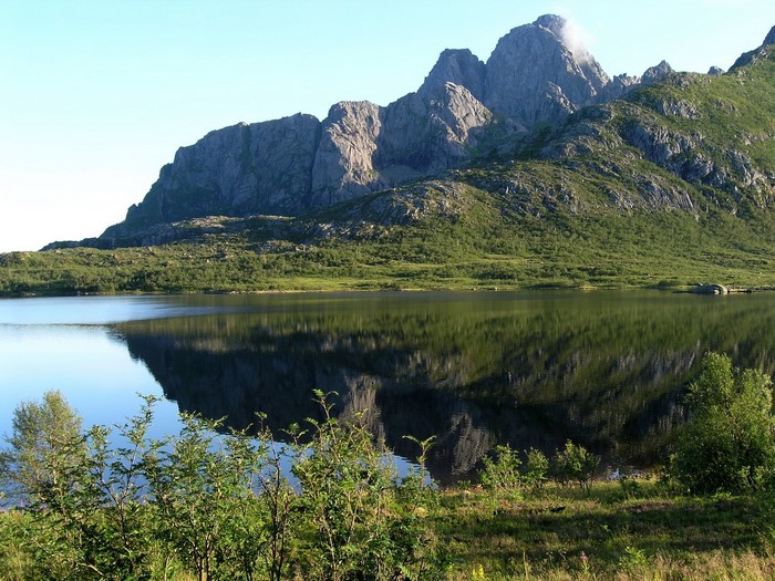 Mountains reflected in a lake in Vagan, Norway