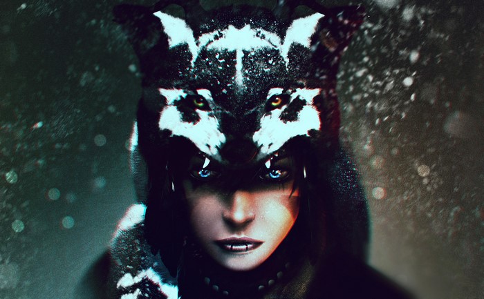 Woman wearing a wolf headdress in the snow
