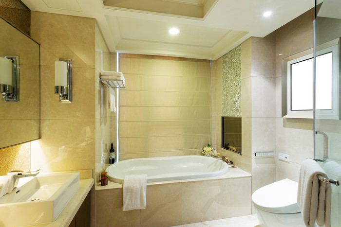Interior of a modern bathroom with bathtub and sink