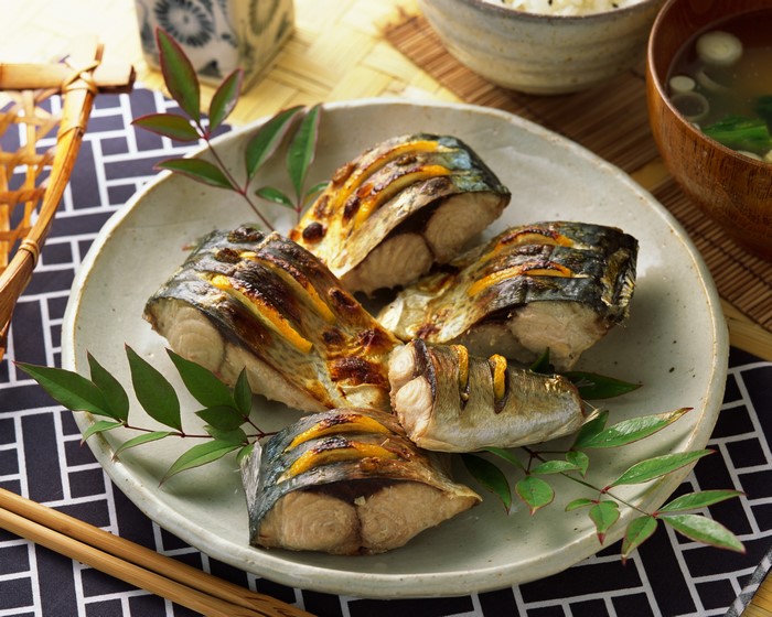 Grilled Fish on Plate with Green Leaves