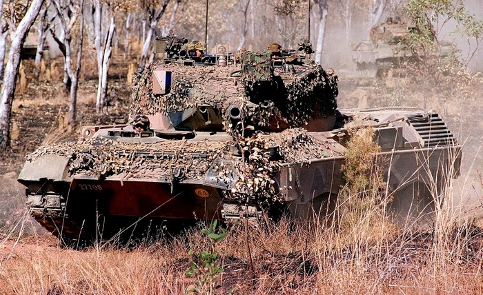 Leopard 2 tank in a dry, wooded area