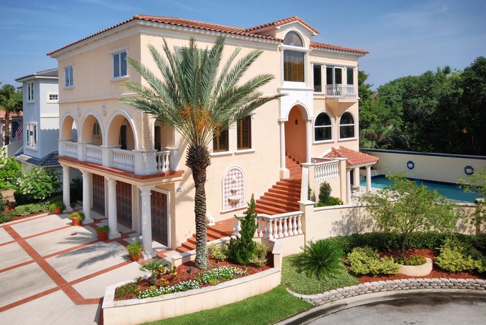 Luxury Mediterranean style house with palm trees and pool