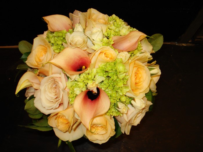 Peach and cream roses with calla lilies and hydrangeas bouquet