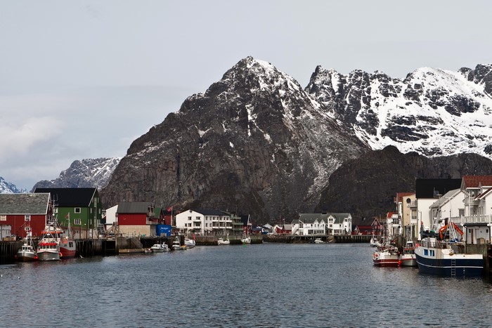 Fishing village with snow-capped mountains in Lofoten, Norway