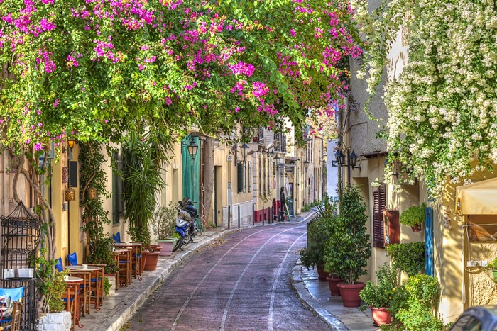 Street with blooming bougainvillea in Greece