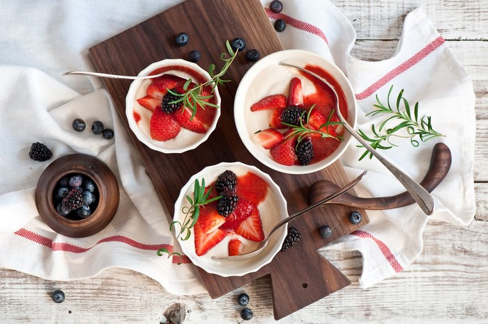 Dessert with strawberries, blackberries, and rosemary