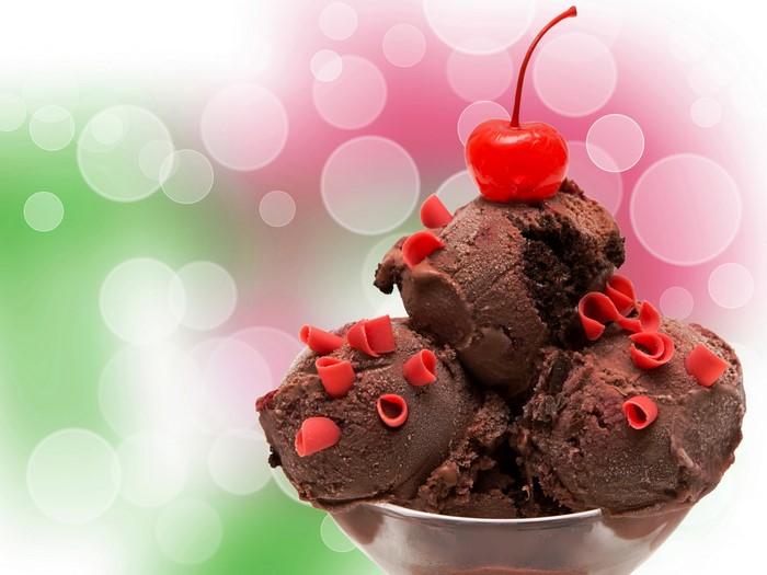 Chocolate ice cream with cherry and red curls