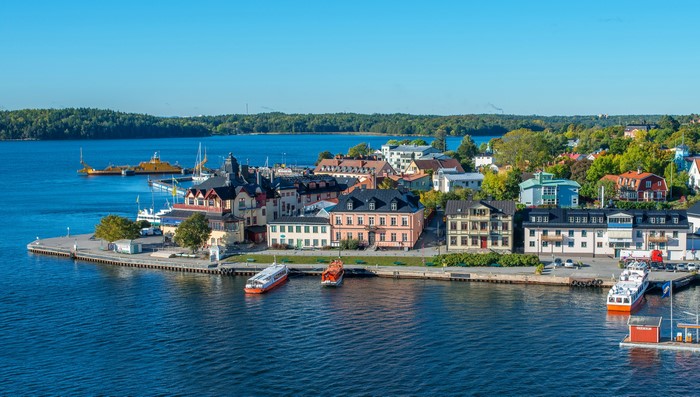 Vaxholm, Sweden waterfront with colorful buildings and boats