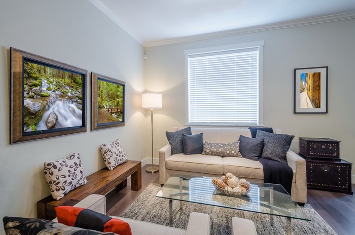 Living room with sofa, coffee table, and artwork