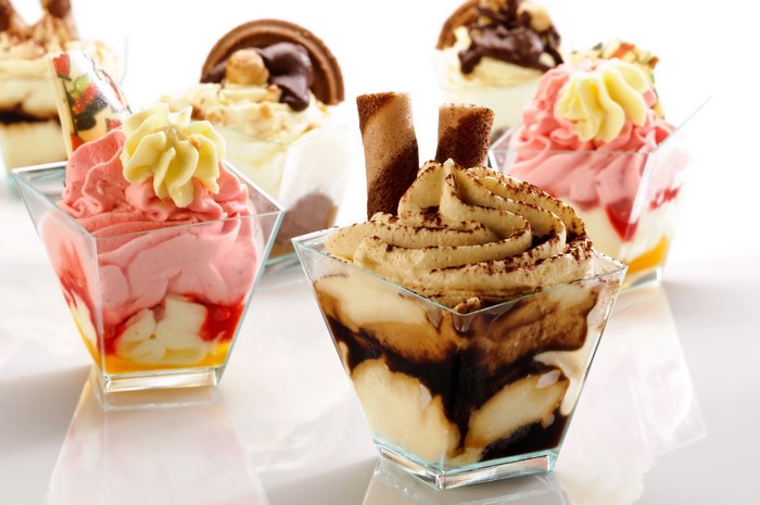 Assortment of ice cream desserts in clear cups