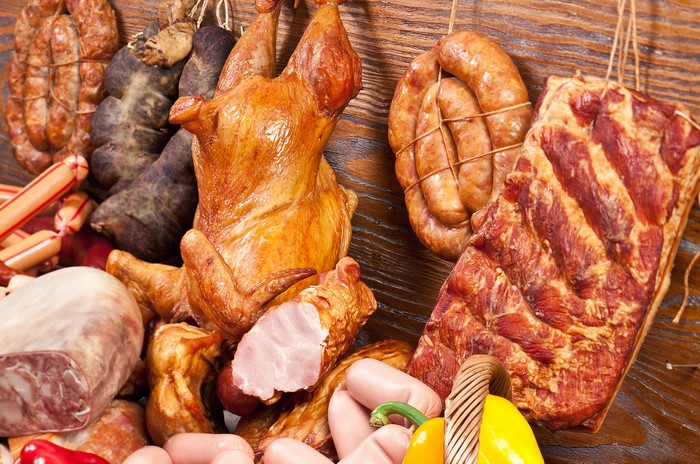 Assortment of cured meats and a roast chicken