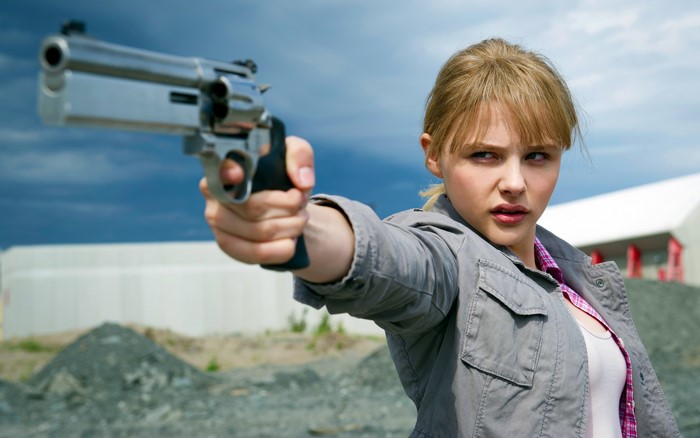 Hit-Girl from Kick-Ass holding a pistol