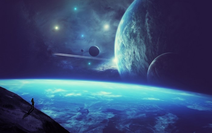 A lone figure on a planet overlooking a vast blue ocean and other planets