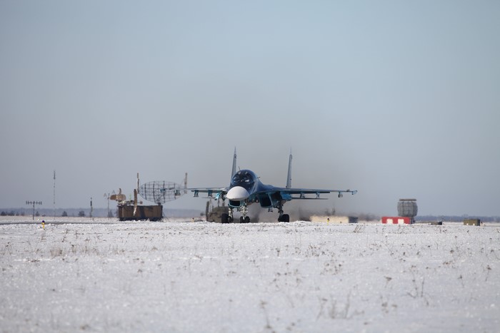 Sukhoi Su-34 Fullback bomber on snowy airfield