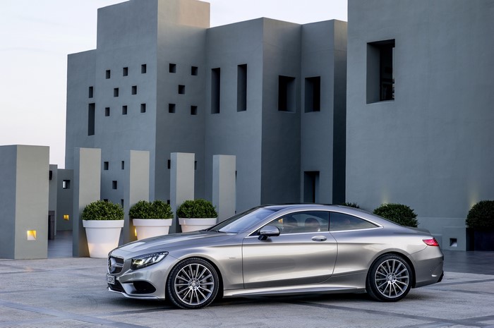 Silver Mercedes-Benz S500 Coupe 4Matic parked near modern building