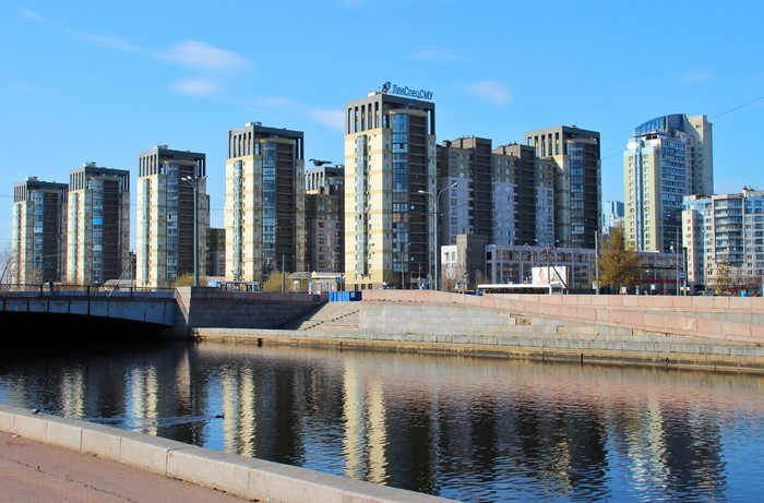 Modern apartment buildings on the river in St. Petersburg, Russia