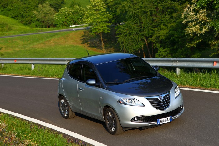 Silver Lancia Ypsilon driving on a road