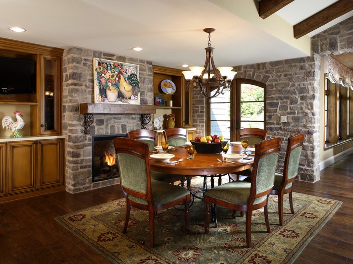Dining room with fireplace and chandelier