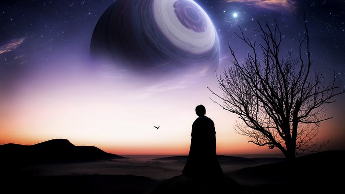 Person looking at a planet in the night sky