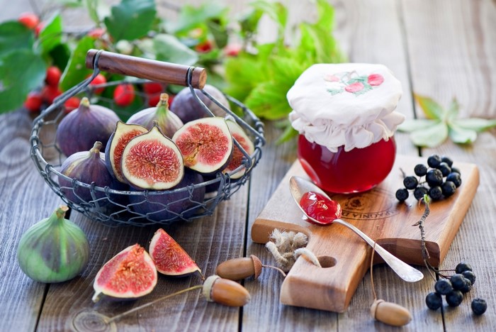 Figs and jam on a wooden table
