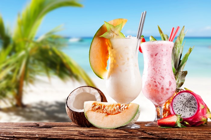 Tropical Cocktails with Fruits on a Beach