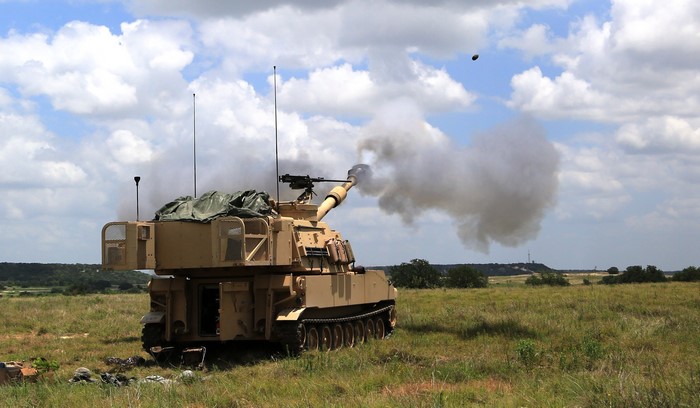 M109 Self-Propelled Howitzer firing artillery shell