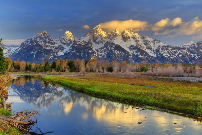 Grand Teton Mountains reflected in a river in Wyoming