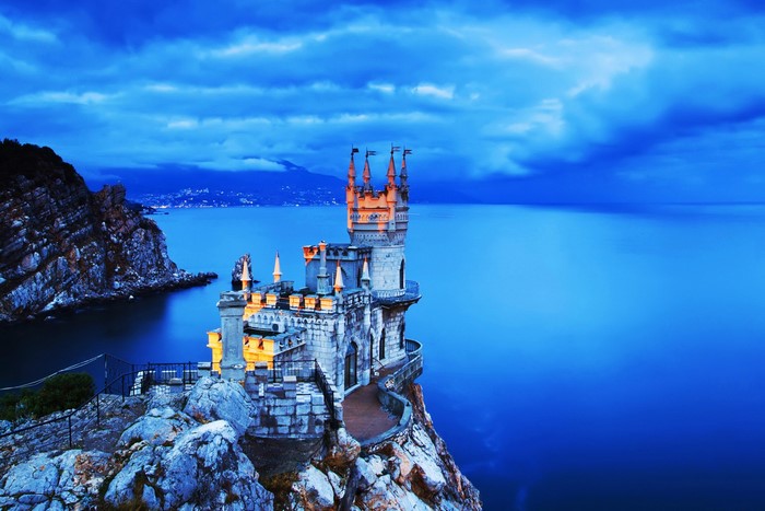 Swallow's Nest Castle on a cliff overlooking the sea at dusk