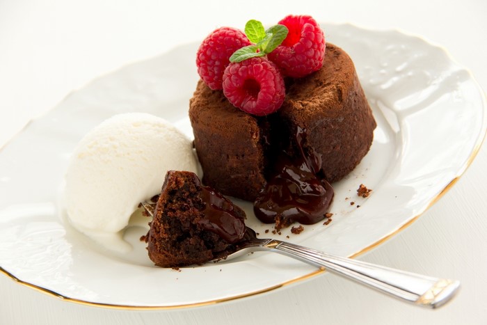 Chocolate lava cake with ice cream and raspberries